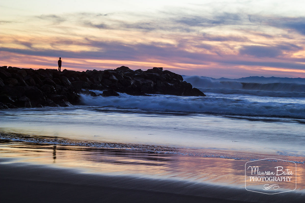 Man On The Rocks Watching Sunset by Maureen Bates Photography