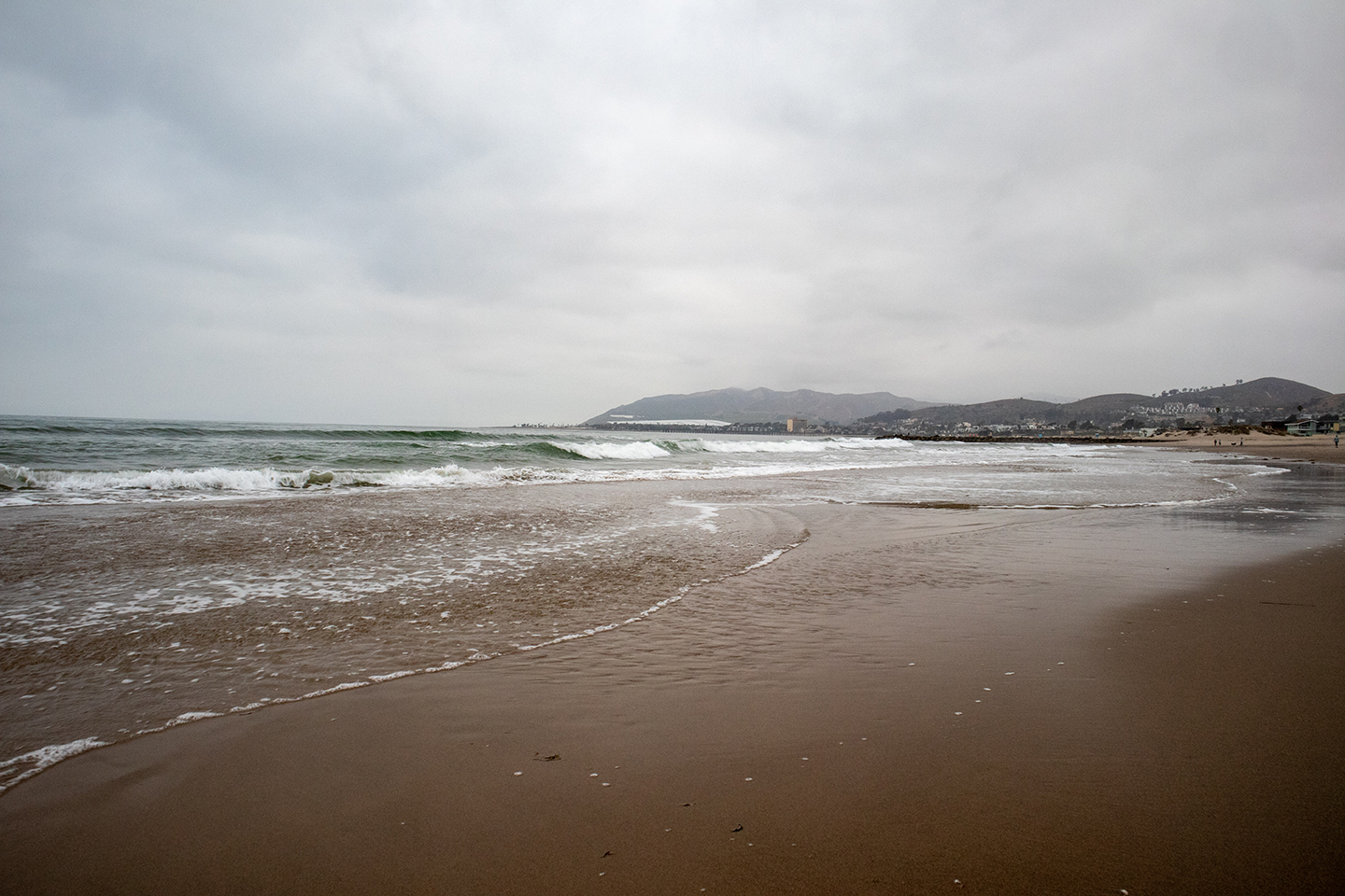 Ventura City in the background with the Pacific Ocean crashing onto the Ventura beach
