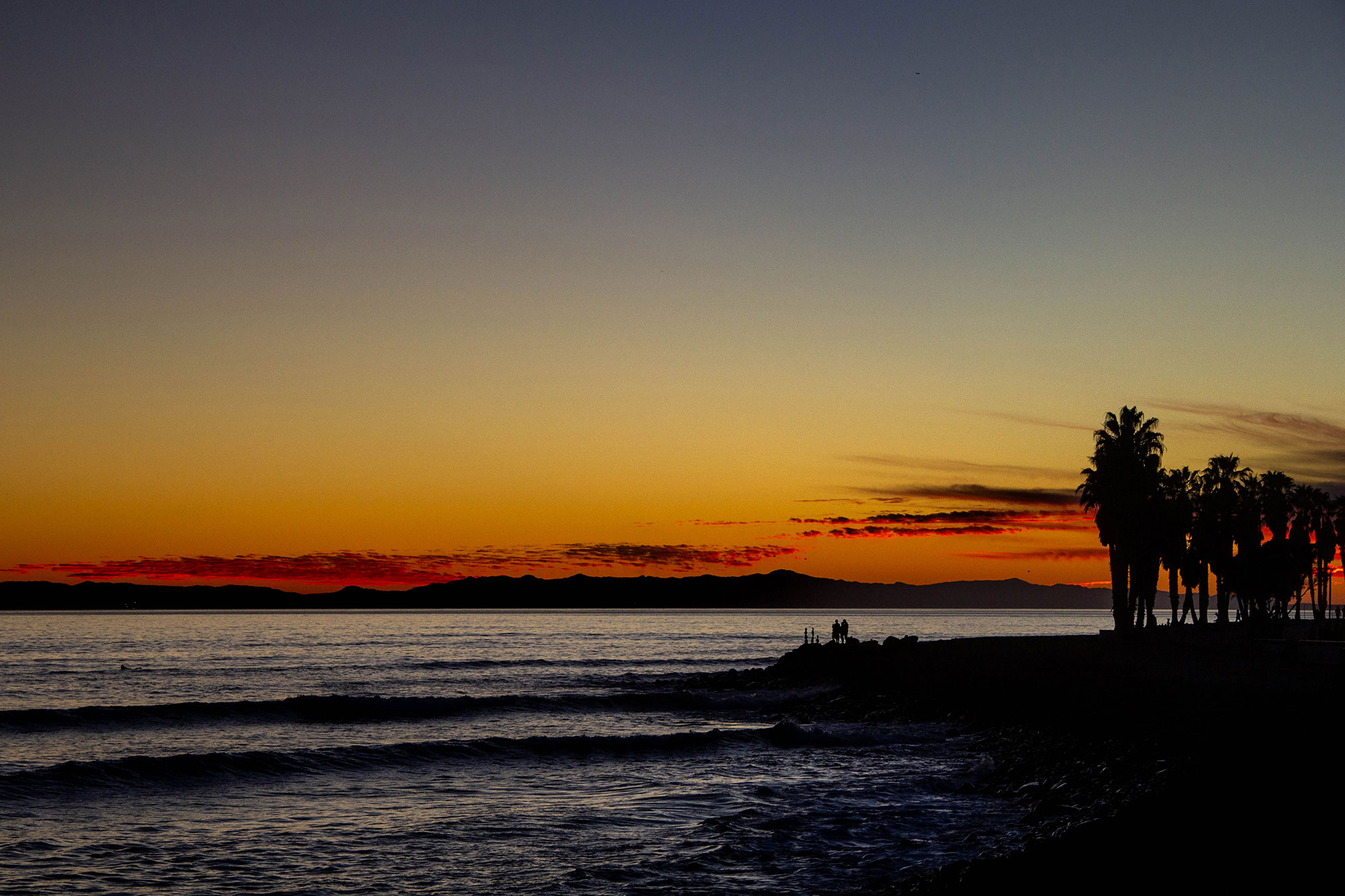 Maureen Sarah Photography Sunset Over The Pacific Ocean silhouette of palm trees