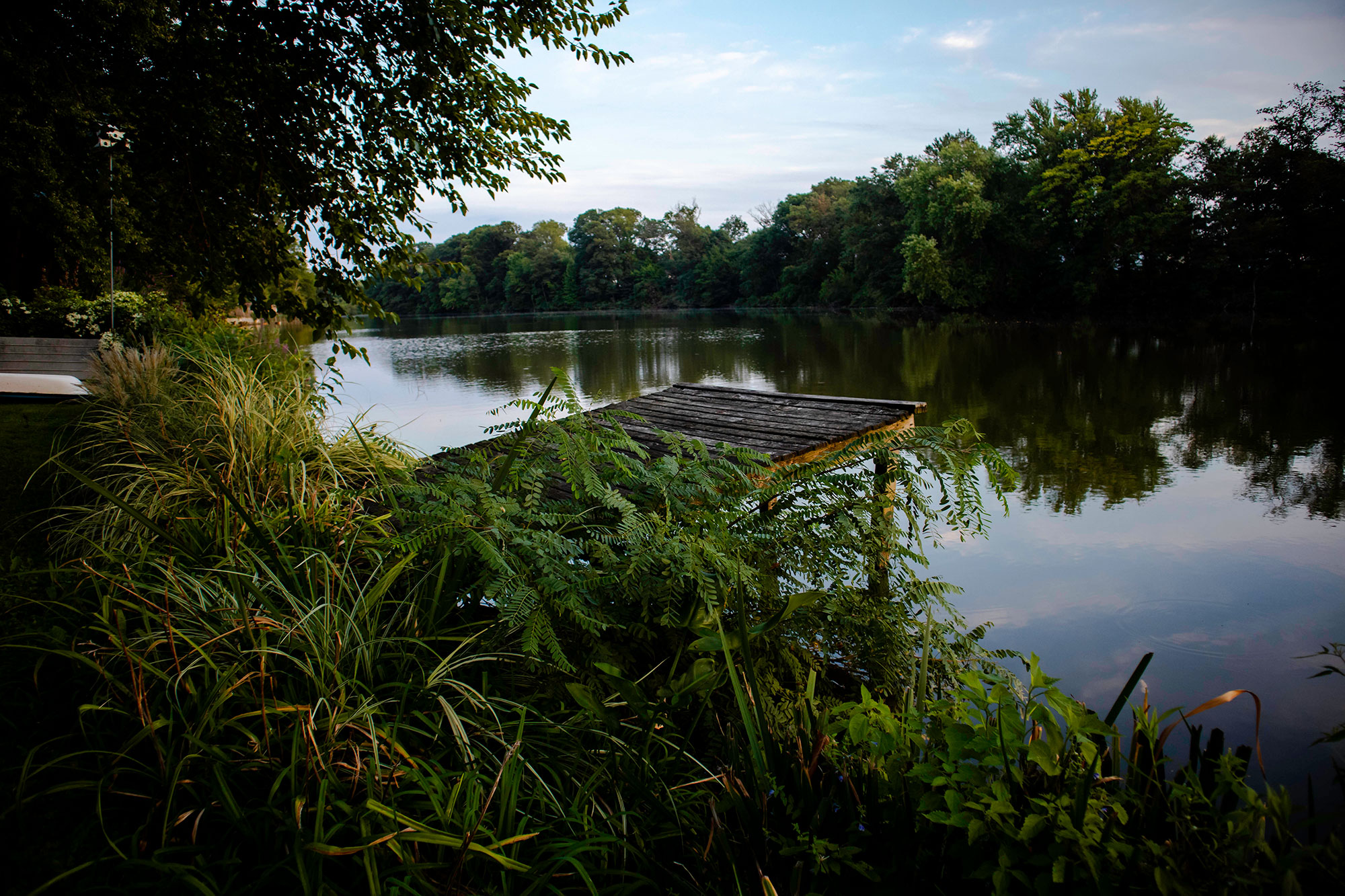 Old wooden dock on river in New Jersey at sunset by Maureen Sarah Photography